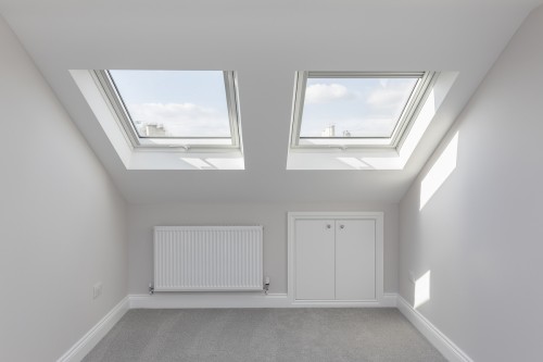 Two large velux windows and plenty of storage space in the eaves 