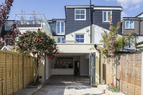 View of the loft from the rear garden (We also did the loft conversion at the property next door with the glass balcony some years ago) 